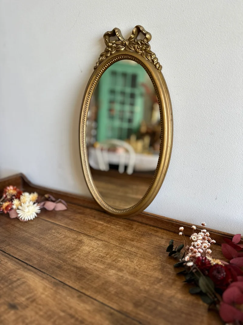 Miroir ovale fronton noeud en plastique années 70