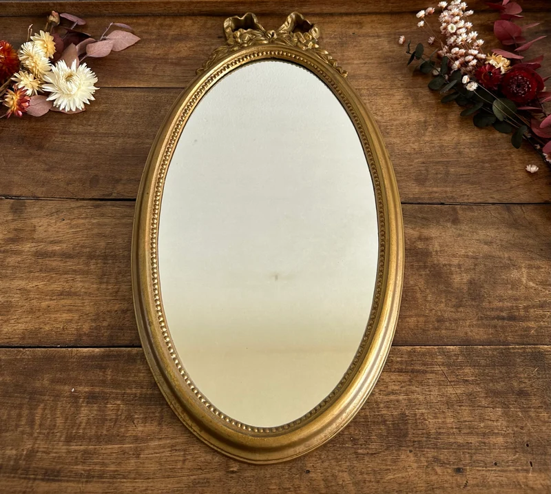 Miroir ovale fronton noeud en plastique années 70
