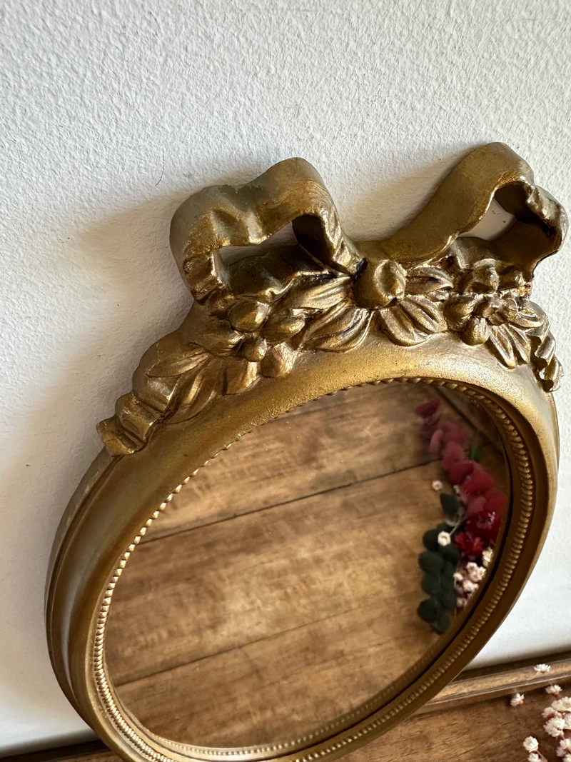 Miroir ovale fronton noeud en plastique années 70