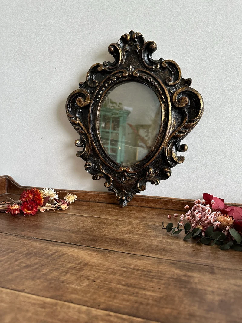 Miroir florentin en bois couleur noir et or