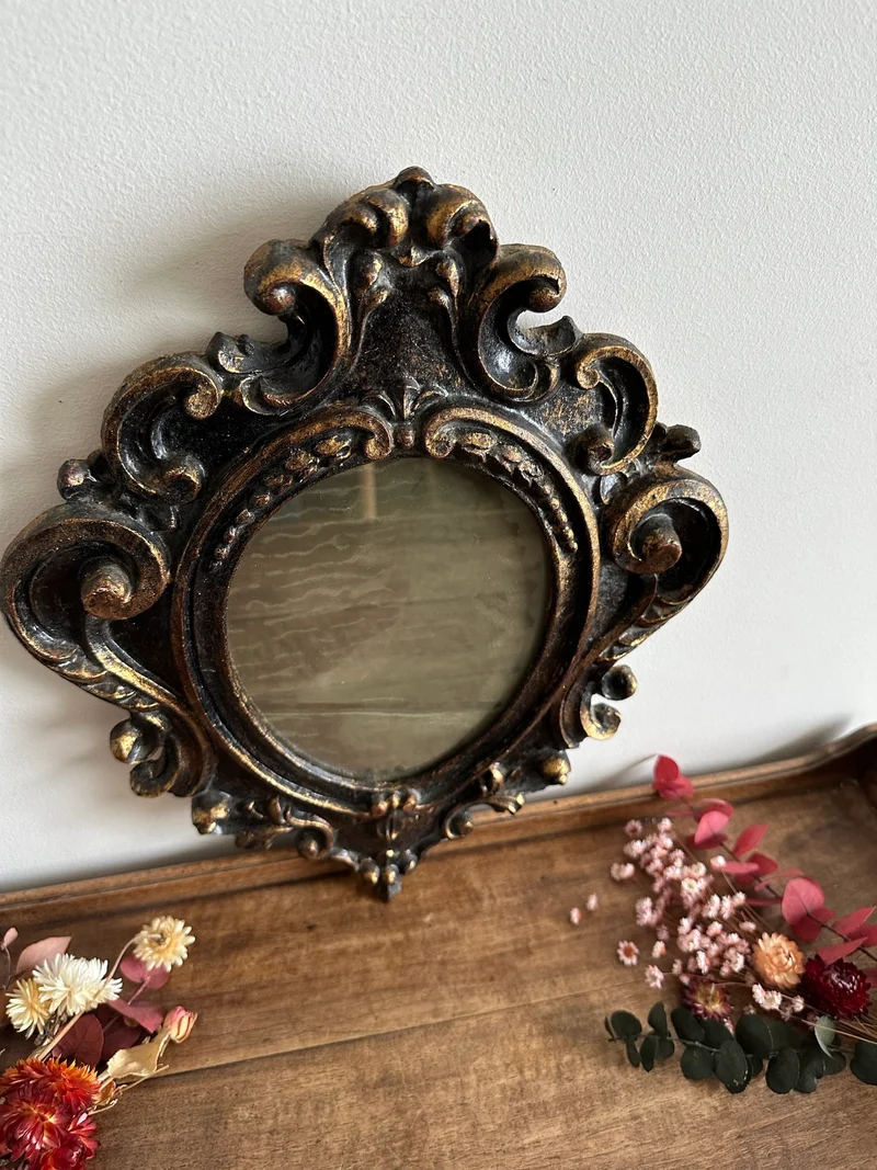 Miroir florentin en bois couleur noir et or