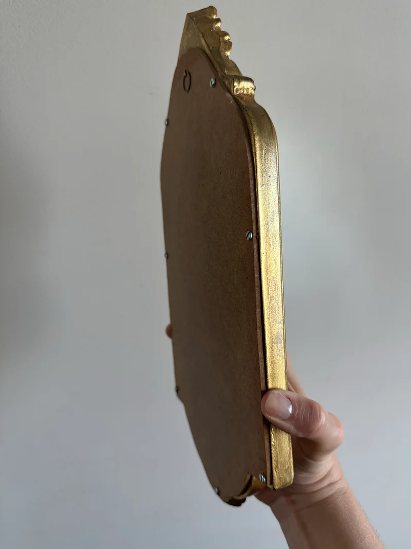 Miroir chantourné en bois doré