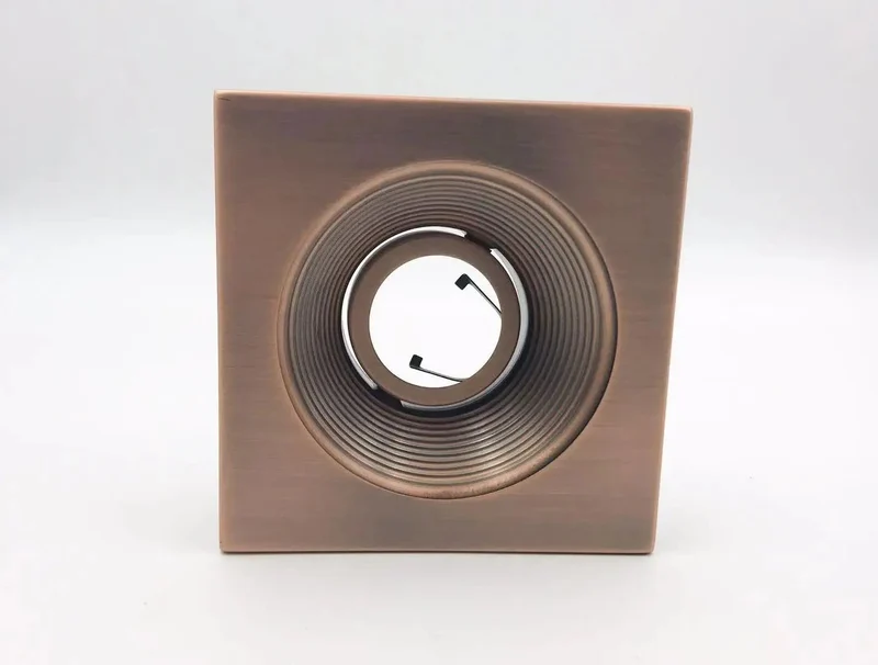 4 Inch Recessed Can Light With Square Trim And Antique Bronze Finish Adjustable 30 Degree GU10 Compatible 120 Volt Low Voltage Smooth Stepped Baffle Knockout Finish Straight Shot Install