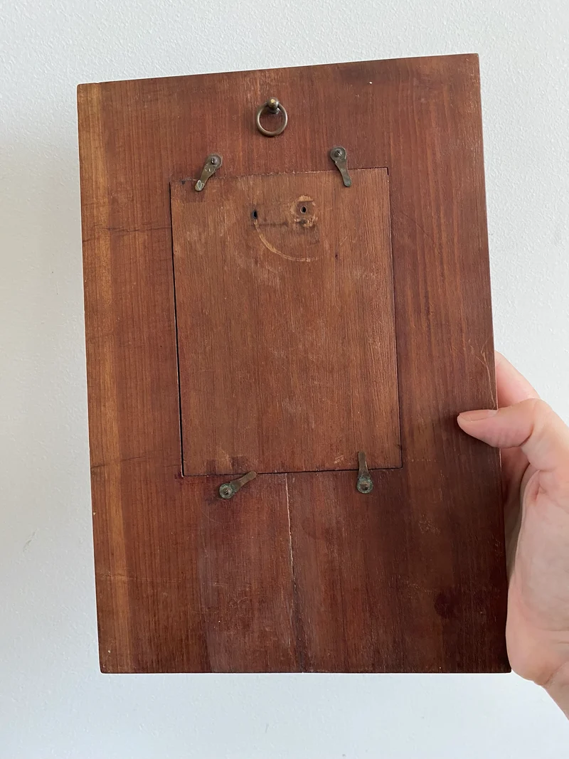 Miroir encadré bois décoré d'une plaque de cuivre