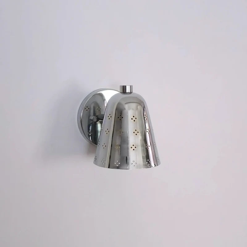 Handcrafted Solid Brass Wall Sconce Sporting A Slick Mid Century Cone Shape With Perforated Metal Accents Casting Killer Shadow Effects For Top Tier Ambient Lighting Vibes