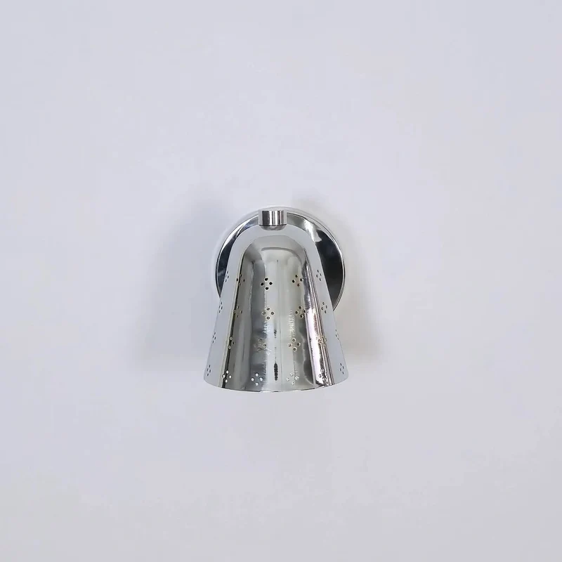 Handcrafted Solid Brass Wall Sconce Sporting A Slick Mid Century Cone Shape With Perforated Metal Accents Casting Killer Shadow Effects For Top Tier Ambient Lighting Vibes