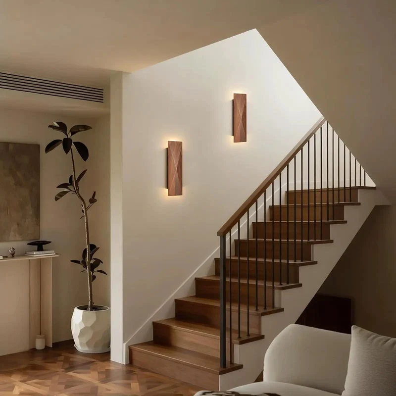 Set Of Two Genuine Walnut Wood Wall Sconces Backed By A Sleek Metal Frame Delivering Top Shelf Vintage Interior Lighting Fixtures That Bring A Slick Modern Vibe To Any Bedroom Or Living Room