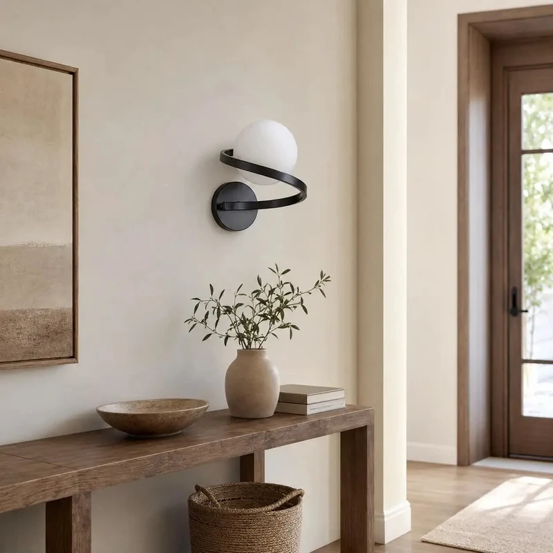 Smooth Black Wall Sconce Featuring Opal Glass Globe And Sculptural Spiral Metal Frame For Contemporary Home Decor Indoor Lighting And Living Room Ambiance