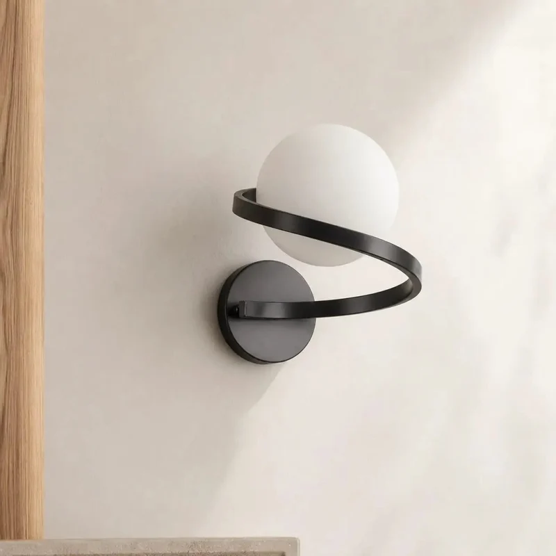 Smooth Black Wall Sconce Featuring Opal Glass Globe And Sculptural Spiral Metal Frame For Contemporary Home Decor Indoor Lighting And Living Room Ambiance