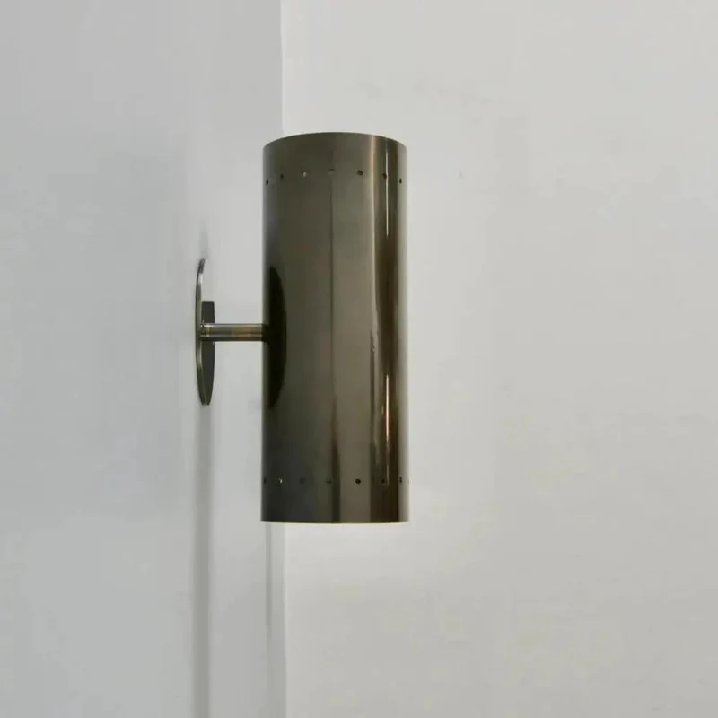 Badass Handcrafted Perforated Brass Wall Sconce With Sleek Cylinder Body And Tight Geometric Detailing For Killer Ambient Glow And Fresh Living Room Decor Swaps