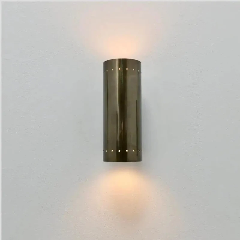 Badass Handcrafted Perforated Brass Wall Sconce With Sleek Cylinder Body And Tight Geometric Detailing For Killer Ambient Glow And Fresh Living Room Decor Swaps