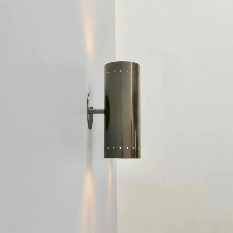 Badass Handcrafted Perforated Brass Wall Sconce With Sleek Cylinder Body And Tight Geometric Detailing For Killer Ambient Glow And Fresh Living Room Decor Swaps