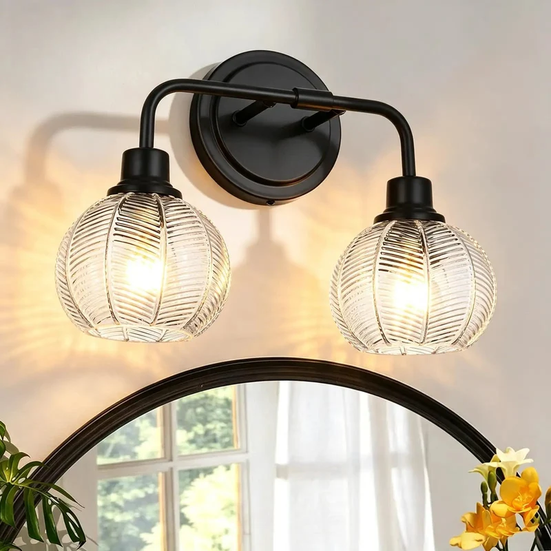 2 Light Wall Sconce Features Curved Arms And Ribbed Glass Shades With Dope Matte Black Finish Rustproof Build E26 Bulb Base Perfect For Bathrooms Kitchens Hallways Living Rooms Bringing Major Bougie Vibe To Any Space Super Sleek Look