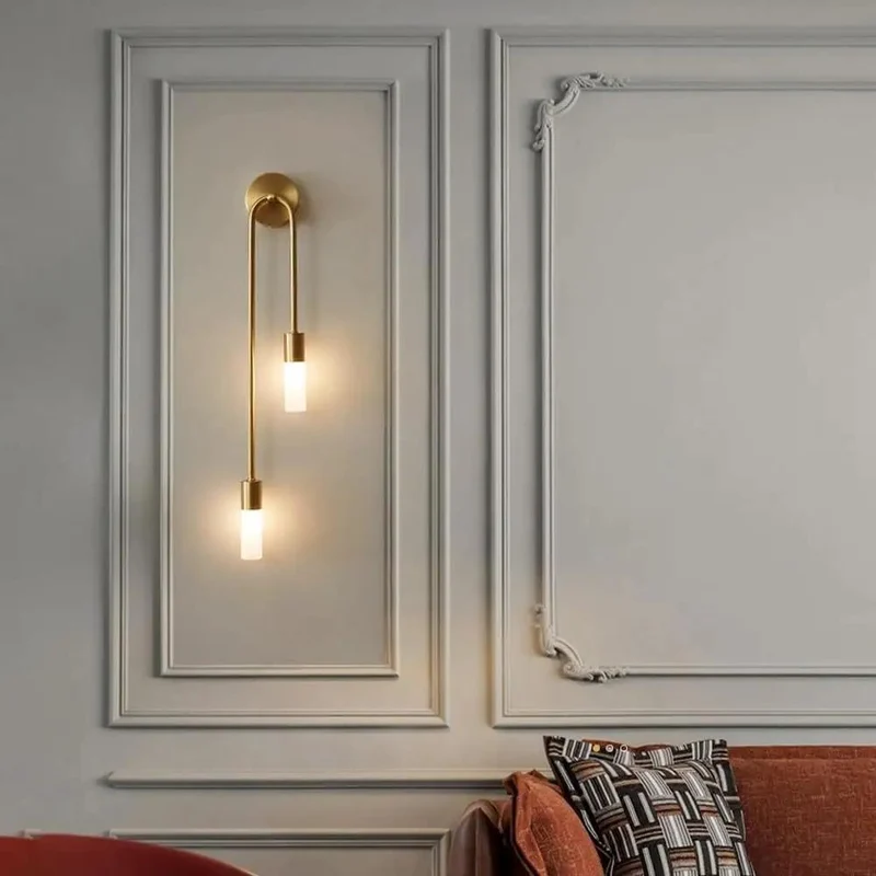 Modern Wall Sconce Featuring Smooth Linear Curves For Totally Fresh Up Down Ambient Lighting Crafted In Premium Brushed Gold Finish To Deliver Major Contemporary Vibes For Bedroom Or Entryway Walls