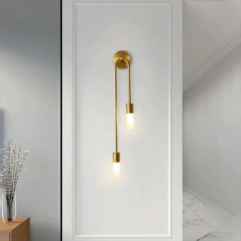 Modern Wall Sconce Featuring Smooth Linear Curves For Totally Fresh Up Down Ambient Lighting Crafted In Premium Brushed Gold Finish To Deliver Major Contemporary Vibes For Bedroom Or Entryway Walls