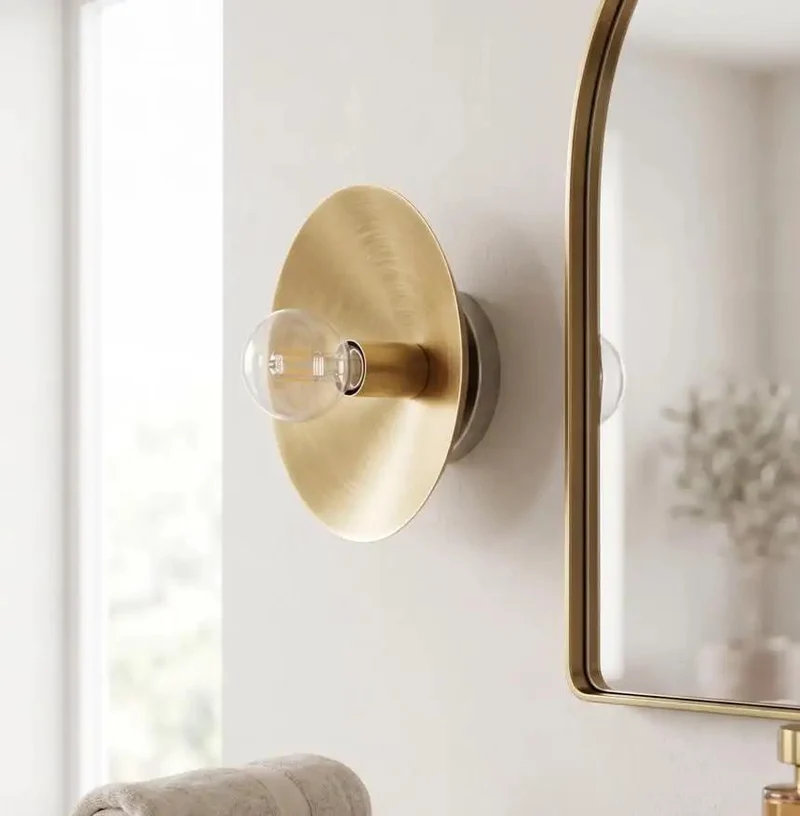 Top Shelf Brushed Brass Wall Sconce With Exposed Edison Bulb And Sleek Round Backplate Bringing Clean Mid Century Modern Bedroom Lighting Vibes To Any Corner