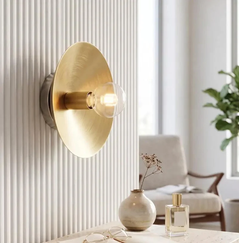 Top Shelf Brushed Brass Wall Sconce With Exposed Edison Bulb And Sleek Round Backplate Bringing Clean Mid Century Modern Bedroom Lighting Vibes To Any Corner