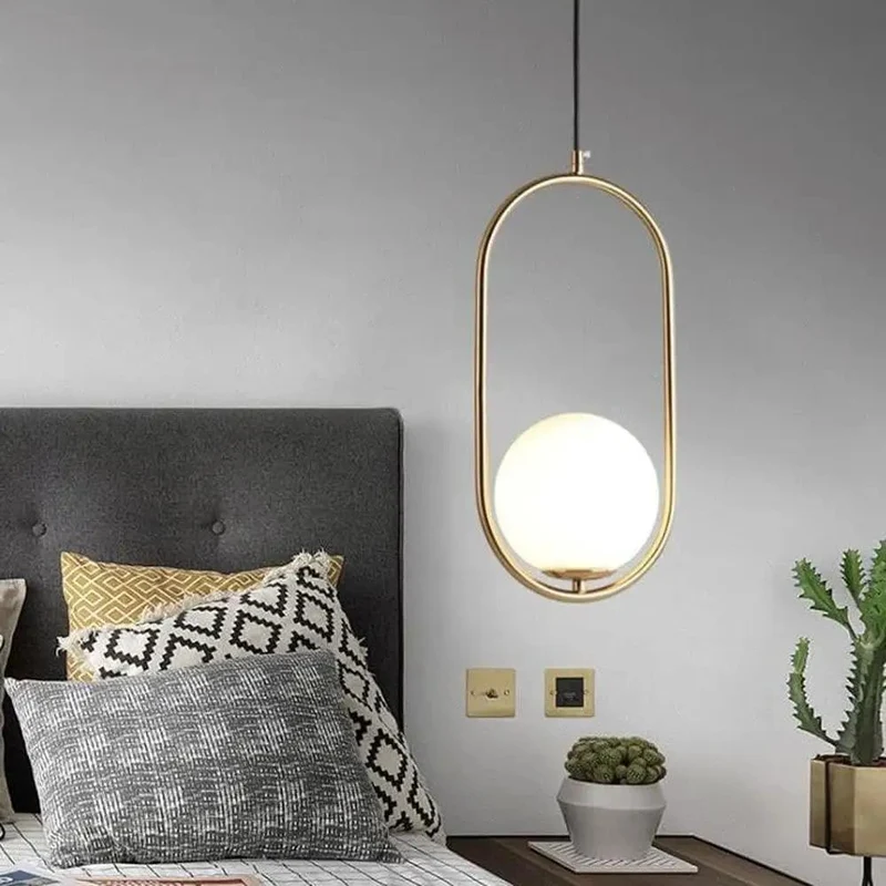Sleek Oval Pendant Light Featuring Frosted White Glass Globe And Brushed Brass Frame Delivers Smooth Glare Free Illumination Perfect For Chic Bedroom Ambiance And Contemporary Living Room Setup Vibes