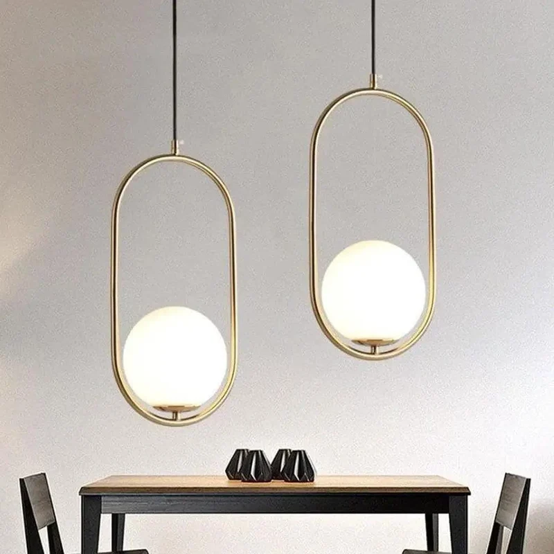 Sleek Oval Pendant Light Featuring Frosted White Glass Globe And Brushed Brass Frame Delivers Smooth Glare Free Illumination Perfect For Chic Bedroom Ambiance And Contemporary Living Room Setup Vibes