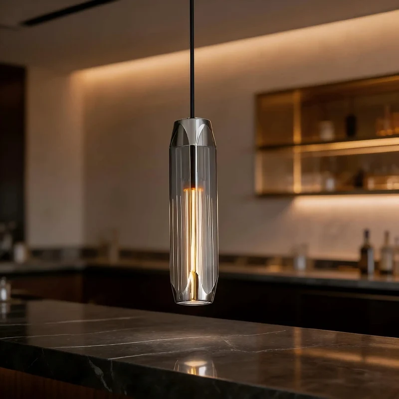 No Fuss Modern Pendant Light Featuring Easy Length Adjust And Hella Cool Smoke Gray Crystal Shade With Polished Brass Accents For Kitchen Islands Dining Rooms And Bar Counters
