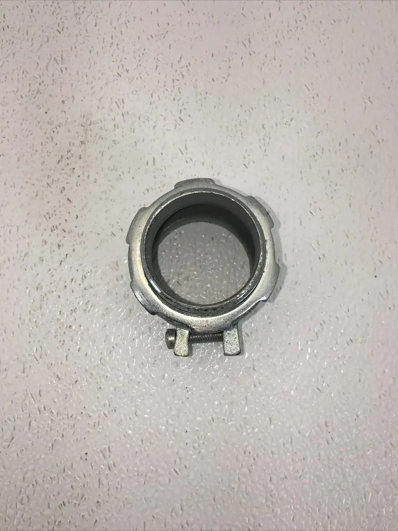 Built Tough One And A Half Inch Squeeze Connector For Electrical Conduit Featuring A Snug Grip Setup And Zero Fuss Install Designed For Electricians Who Want Rock Solid Metal Pipe Joints For Every Single Project On Site